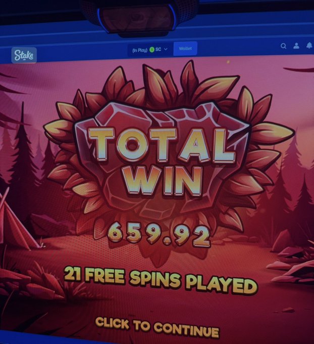 The image displays a "TOTAL WIN" screen from a Stake casino slot game showing 659.92 in winnings after 21 free spins played. It relates to the post by showcasing a gambling win on Stake, fitting the theme of engaging with the platform mentioned in the giveaway.