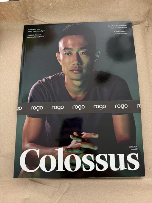 The image shows the cover of "rogo" magazine, Issue 06 (June 2025), titled "Colossus," featuring a young man in a dark t-shirt with his hands clasped, alongside taglines referencing "The Lab, A Vision of Palantir's Mirage Number" and "Startup Foundry's 20 Years of Failure." The cover ties to Hyperliquid by visually capturing the term's meaning—a colossal figure—mirroring the platform's massive influence and growth in the crypto space.