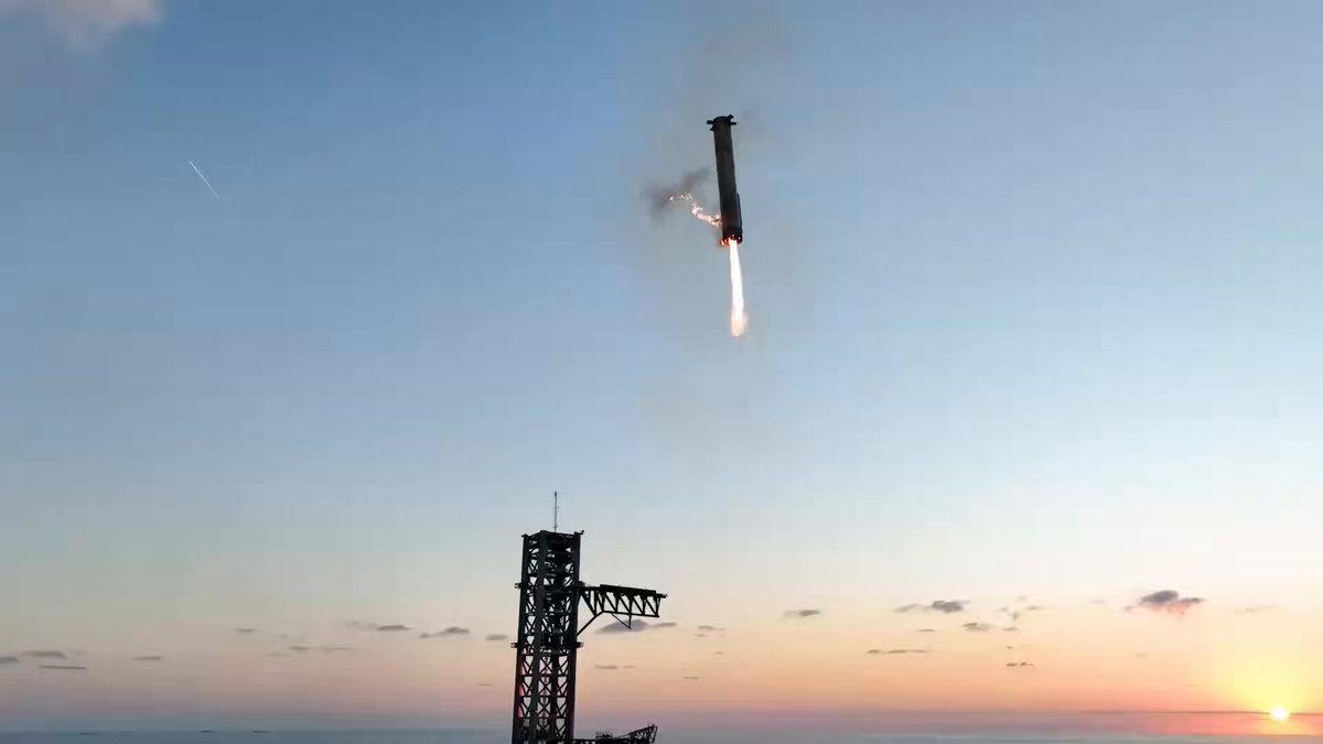 The image shows a rocket launch taking place against a beautiful sunset sky. The rocket can be seen flying high above, leaving behind a trail of smoke as it ascends into the sky. Below the rocket, there are two towers - one on each side of the launching site. The text in the image reads "GM HGS @Sajwani ALGORAND." This suggests that the launch might have been part of an experiment or research project by GM HGS at Sajwani.