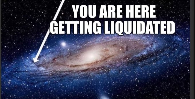 A cosmic meme shows the Andromeda galaxy with text reading "YOU ARE HERE GETTING LIQUIDATED," with an arrow pointing to a small speck, humorously putting the trader's losses in galactic perspective. The post's question "so does it really matter?" plays on the futility of worrying about liquidation events when viewed against the vastness of the universe.
