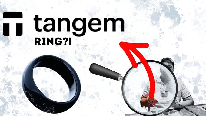 An advertisement for 'tangem' featuring a black smart ring on the left and a magnifying glass on the right showing a person examining the ring, with a red arrow pointing to the logo and 'RING?!' text.