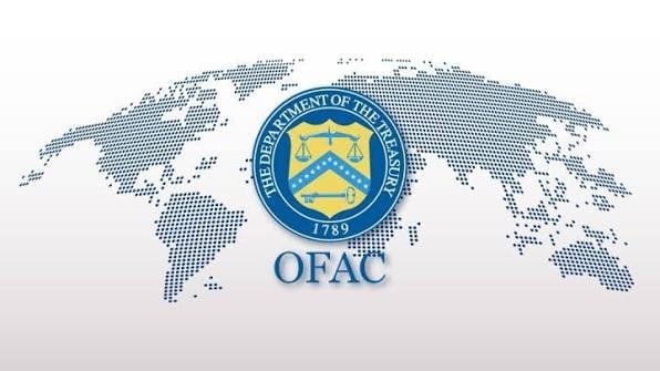 The image features the seal of the U.S. Department of the Treasury dated 1789 with "OFAC" displayed below, set against a dotted world map background, representing the Office of Foreign Assets Control's sanctions action against cryptocurrency exchanges Abantether and Shellbit for facilitating transactions with Iranian entities.