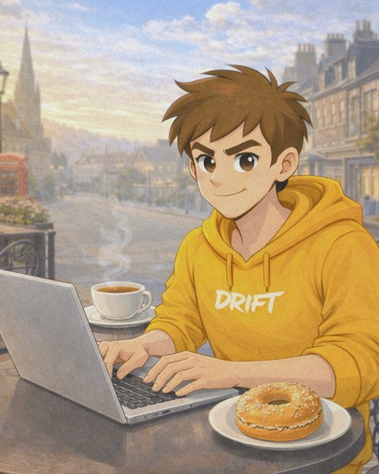 An animated character wearing a yellow 'DRIFT' hoodie works on a laptop at an outdoor café table with a cup of coffee and a glazed donut, set against a European-style cityscape.