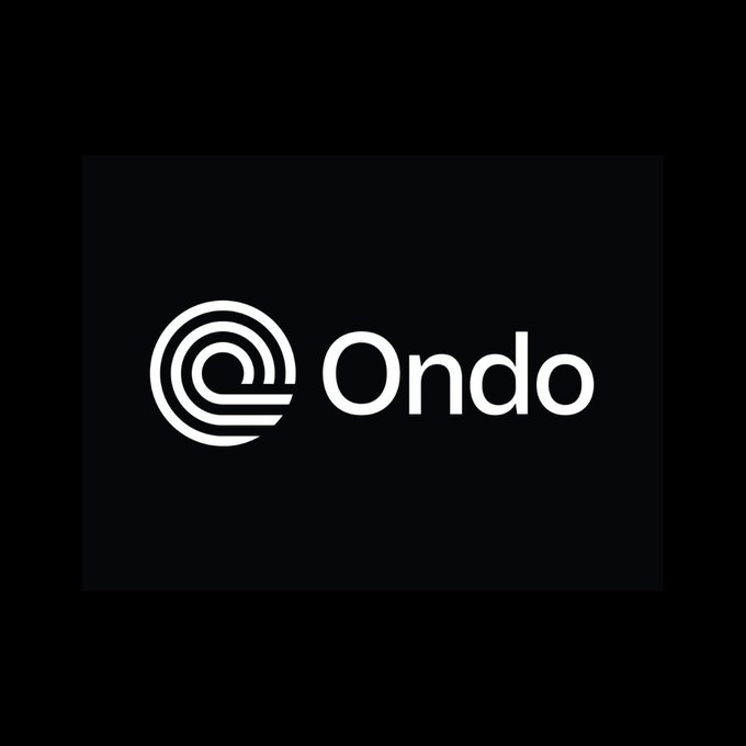 The image displays the Ondo logo, featuring a stylized white circular emblem next to the brand name "Ondo" on a black background, aligning with the post announcing the launch of Ondo's 24/7 perpetual futures markets for equities, ETFs, and commodities.