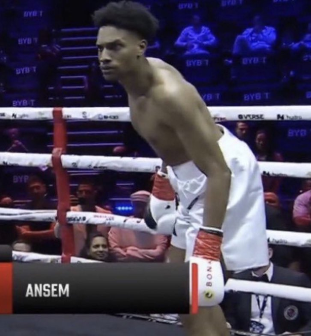 A boxer wearing white trunks and gloves stands in a boxing ring, with "ANSEM" displayed on the nameplate and "BYB" visible on the ropes, suggesting a BYB Extreme Fighting Series event.