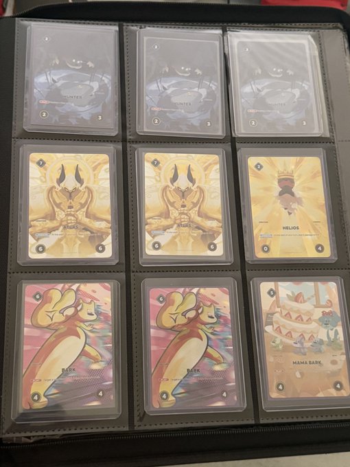 A nine-pocket binder page displays a Pokémon TCG collection, including Hunter, Helios, Flaaffy, and Mama Bear cards arranged in three rows of three.