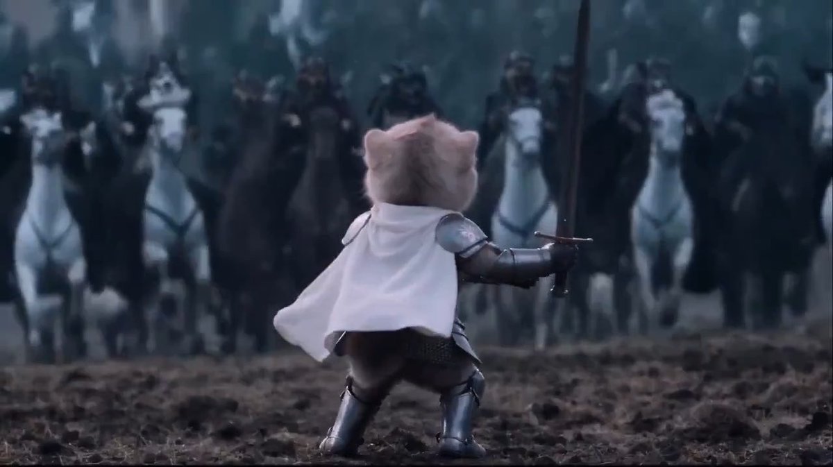 A small armored cat-like figure stands defiantly on a battlefield, brandishing a sword toward an ominous line of dark riders on horseback. The image playfully mirrors the post's message, using the epic "brave warrior facing overwhelming odds" scene as a humorous metaphor for an investor holding firm against FUD (fear, uncertainty, and doubt).