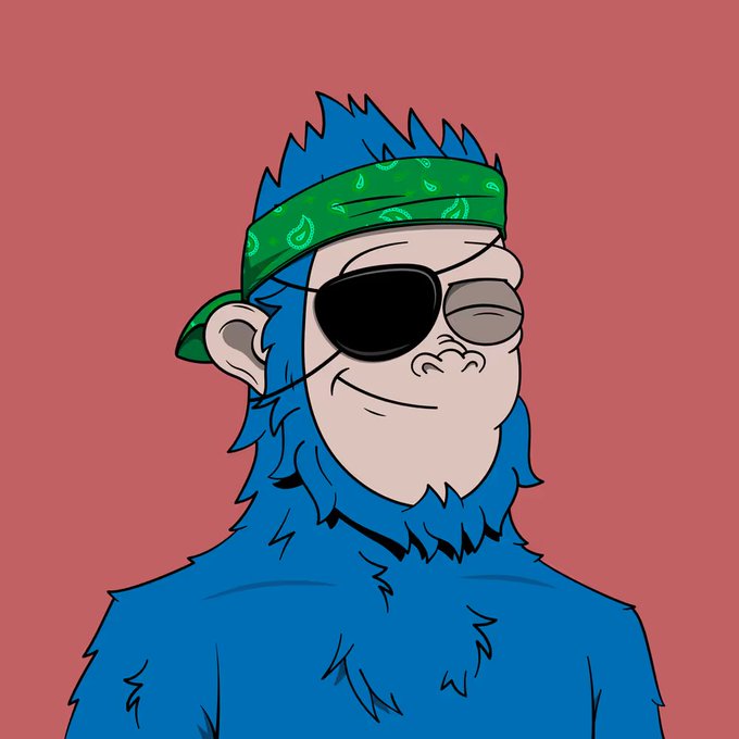 A cartoon illustration of a smug, blue-furred monkey-like character wearing a green paisley bandana and an eyepatch, set against a red background. The image ties into the post by serving as the profile picture of "ShreddingSassy," suggesting the bandana is a new merch item that wards off bad vibes.