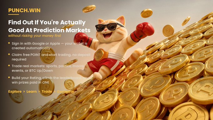A Punch.win advertisement featuring a cat in red boxing gloves and sunglasses triumphantly jumping on a pile of gold coins, with text: 'Find Out If You're Actually Good At Prediction Markets without risking your money first.'