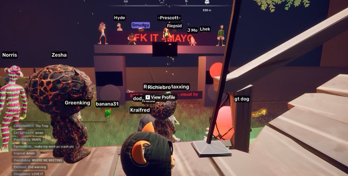 A screenshot from a virtual world game (likely VRChat or Rec Room) showing multiple avatars and players with usernames like 'Hyde', 'Smuggy', 'Zesha', and 'Norris' around a stage with 'GFK IT MAKO' text.