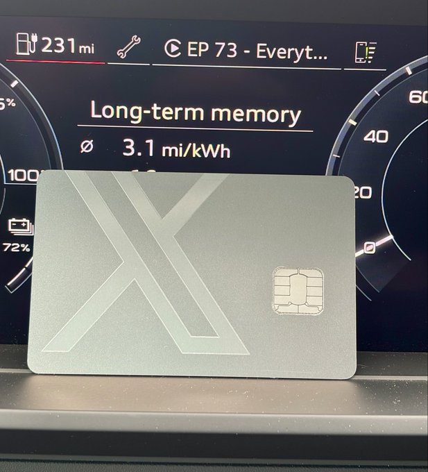 A gray metallic 'X' branded card with an embedded smart chip rests on a car dashboard displaying '231mi' range, 'Long-term memory 3.1 mi/kWh', and 'EP 73 - Everyt...' status.