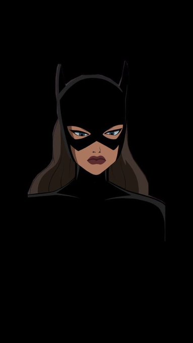 An illustration of a female Batman character with brown hair, blue eyes, and a black cowl, emerging from darkness.