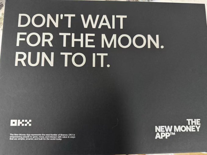 A black OKX promotional insert reading "DON'T WAIT FOR THE MOON. RUN TO IT." alongside "THE NEW MONEY APP™" branding, packaged with a Mid-Autumn Festival gift box featuring a sportswear set to encourage the recipient to stay active instead of constantly watching charts.