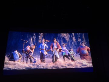 A theatrical stage performance featuring costumed performers portraying the Eight Immortals, set against a misty mountain backdrop. The image illustrates the post's reference to the legendary Chinese figures, paired with a Binance ticket giveaway.
