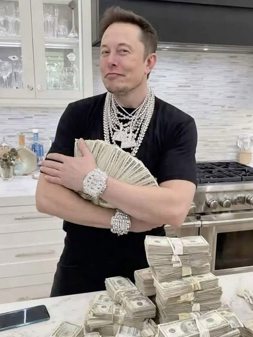 A man stands in a kitchen surrounded by stacks of cash and diamond jewelry, posing confidently with his arms crossed. The image evokes the "$10,000 surprise giveaway" promoted in the caption, visually reinforcing the promise of winnings with a lavish display of money and bling.