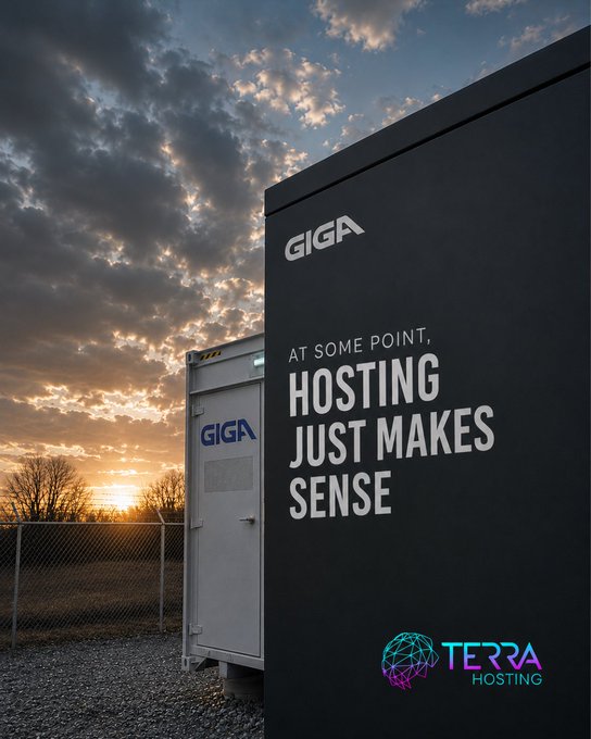 The image shows two large black boxes with white text that reads "At some point, hosting just makes sense. Some miners don't start in industrial facilities. They start in garages. Spare bedrooms. Basements. Anywhere they can fit a machine and enough airflow to keep it alive And honestly? That’s part of the journey." The boxes are located on a gravel lot with trees visible in the background, suggesting that this might be an outdoor or industrial setting.
