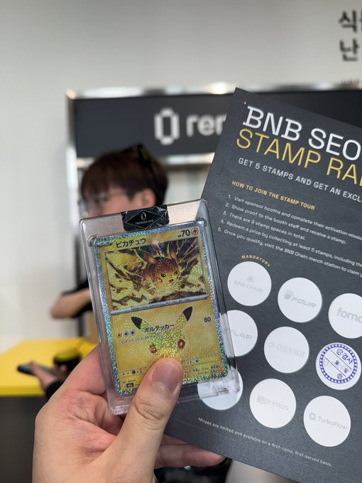 A hand holds a holographic Pikachu and Pikachu EX Pokémon card alongside a 'BNB SEOUL STAMP RALLY' card at what appears to be the BNB Chain booth, with instructions to visit sponsor booths and collect at least 8 stamps for an exclusive reward.