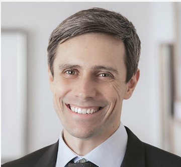 The image features a man wearing a suit with a tie, smiling at the camera. The caption below the photo reads "TSLA News: Piper Sandler analyst Alexander Potter said Tesla's fully autonomous software has effectively reached level 4 Autonomous driving". This suggests that the man is discussing or analyzing the advancements in Tesla's self-driving technology.