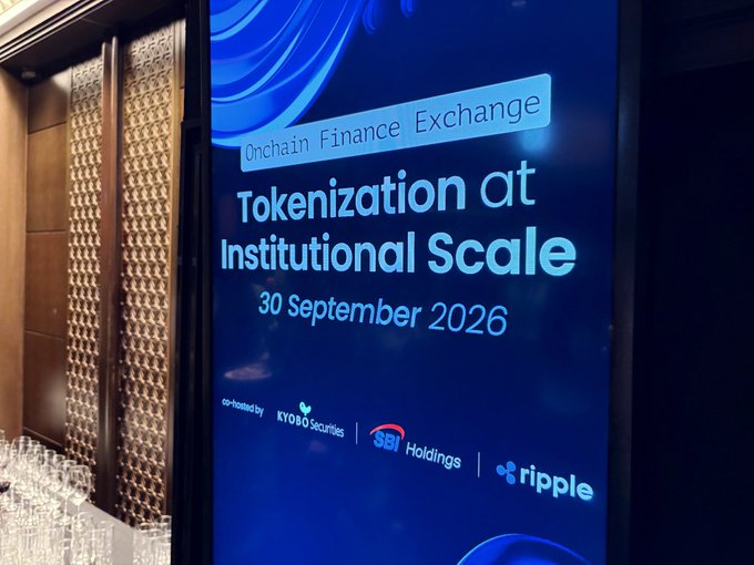A digital screen displays an event titled 'Onchain Finance Exchange: Tokenization at Institutional Scale, 30 September 2026', co-hosted by KYBO Securities, SBI Holdings, and Ripple.