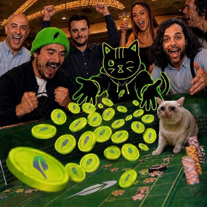 A group of excited people cheer around a casino table, accompanied by a glowing neon green cartoon cat, scattered green "Pudgy Penguins" tokens, and a real white cat sitting among poker chips.