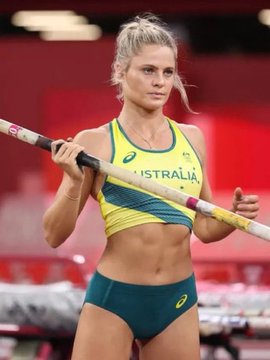 The image shows Australian pole vaulter Nina Kennedy wearing a yellow and green "AUSTRALIA" team uniform while holding a pole, likely at a competition. The accompanying text "BITCOIN ETHEREUM" does not appear to relate to the image content, suggesting it may be misplaced or unrelated to the athlete shown.