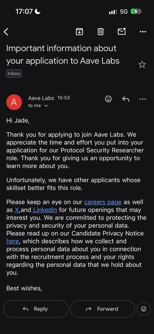 A screenshot of an email rejection letter on a mobile device from 'Aave Labs' addressed to Jade, stating they have other applicants whose skillset better fits the 'Protocol Security Researcher' role.