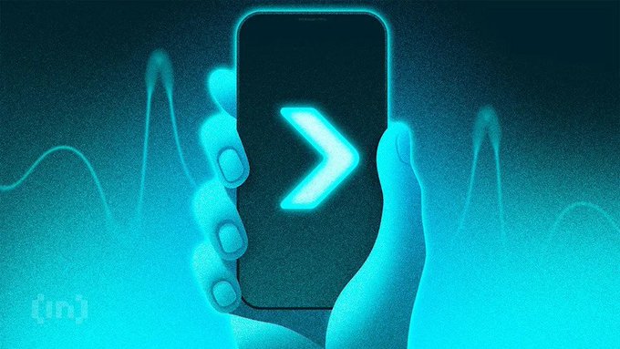 A stylized illustration of a hand holding a smartphone displaying a glowing cyan arrow/chevron icon against a dark blue background with wave patterns and an '{in}' logo in the corner.