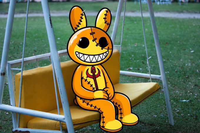 An orange and yellow cartoon character resembling a stitched bunny sits on a yellow cushion of a white porch swing in a grassy yard.
