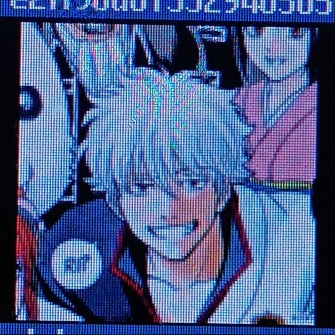 The image shows a close-up of an anime character's face displayed on a pixelated screen with distorted text at the top, evoking a low-resolution or glitchy aesthetic. Its lo-fi, filtered appearance complements the post's relaxed and reflective tone, mirroring the laid-back vibe of the user's monthly recap where they mention averaging 9-10 hours of sleep and emphasizing a slower-paced lifestyle.