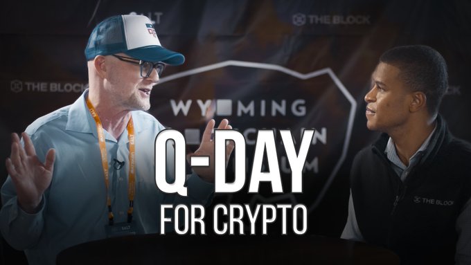 Two men converse at an event with a Wyoming-themed backdrop, overlaid with text reading 'Q-DAY FOR CRYPTO' and 'THE BLOCK' branding visible on the right.