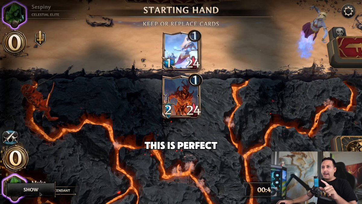 The image shows two players engaged in a game, with one player holding a sword and the other holding a shield. They are facing each other across a large screen displaying a map of a volcano with lava flowing down its sides. The text on the screen reads "This is perfect".