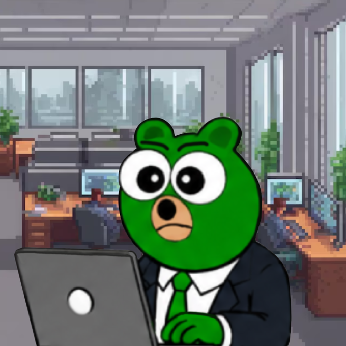 A pixel art style illustration of a green bear-like character wearing a black suit and green tie, sitting at a desk in an office environment while working on a laptop.