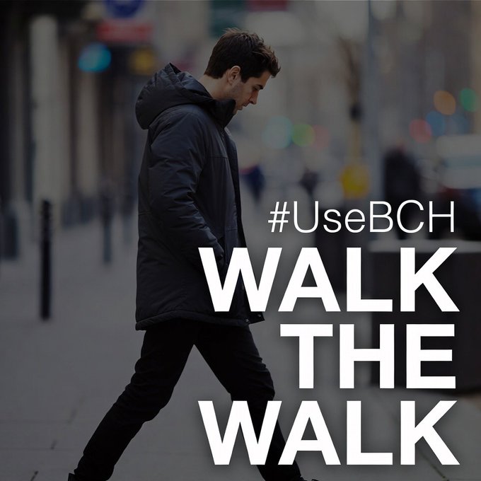 "WalkTheWalk" is a hashtag that has been used as part of an online campaign, likely related to Bitcoin Cash or cryptocurrency. The image features a man walking down a city street while wearing a black jacket with a hoodie pulled up over his head. The text in the image reads "#WalkTheWalk", which could be interpreted as a call for people to engage in more physical activity and walk more often.