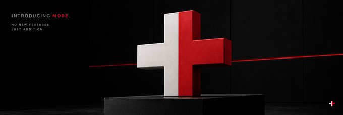 A dark promotional banner reading 'INTRODUCING MORE. NO NEW FEATURES. JUST ADDITION.' featuring a white and red 3D plus sign sculpture on a pedestal.