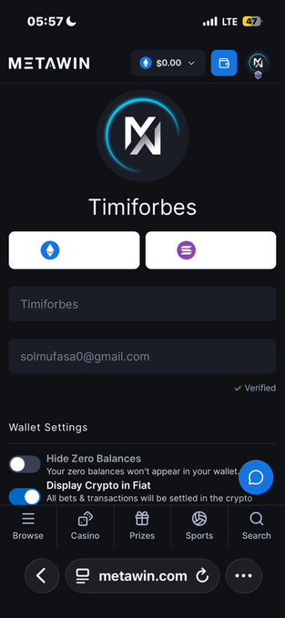 A MetaWin mobile interface showing account 'Timiforbes' with a verified email (solmufasa0@gmail.com), $0.00 balance, and toggle options for 'Hide Zero Balances' and 'Display Crypto in Fiat'.