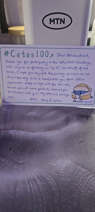 A handwritten thank-you note addressed to "Antichristoct" from "Amy @ Cetus" congratulates them on finishing the Cetus100X Challenge as Top 15, with a small cartoon character and the MTN logo visible on packaging above.