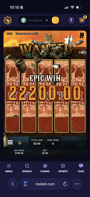 A mobile screenshot of a 'Wanted Dead or a Wild' slot machine game on roobet.com showing an 'EPIC WIN' of 2,200,700, with a balance of $182.86 and 6 free spins.