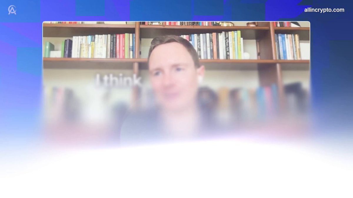The image shows a man sitting at a desk with numerous books surrounding him. The background of the image features a blue and white color scheme, which complements the man's serious expression as he looks directly into the camera. The caption below the image reads "Focus on what is in the image and how it relates to the post".