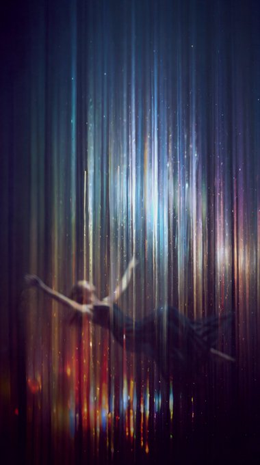 An ethereal digital artwork features a figure floating horizontally against a backdrop of vertical, iridescent light streaks resembling falling starlight.
