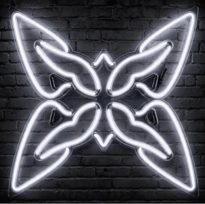 A bright white neon sign shaped like a butterfly mounted on a dark brick wall, glowing brightly with a symmetrical four-wing design.