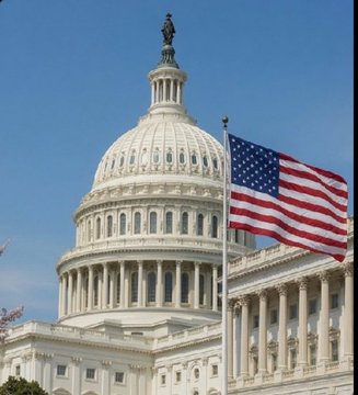 The image shows the U.S. Capitol building with its iconic white dome and the American flag waving in the foreground against a clear blue sky. This visual symbolizes the legislative activity in Washington, directly reinforcing the post's reference to U.S. lawmakers and the CLARITY Act, as the Capitol serves as the epicenter where such crypto regulation decisions are being made.