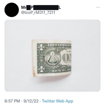 A rolled-up one-dollar bill is displayed against a white background, with the iconic pyramid and "THE UNITED STATES" text visible on the bill. The image, posted at 8:57 PM on 9/12/22, accompanies a message about XRP trading at $1, using the single dollar bill as a visual metaphor for the price point.