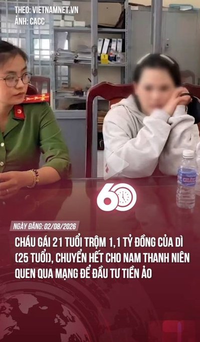 A Vietnamese news segment showing two women at a table; text reads 'CHÁU GÁI 21 TUỔI TRỘM 1,1 TỶ ĐỒNG CỦA DÌ (25 TUỔI, CHUYỂN HẾT CHO NAM THANH NIÊN QUEN QUA MẠNG ĐỂ ĐẦU TƯ TIỀN ẢO)' with a publication date of 02/08/2026.