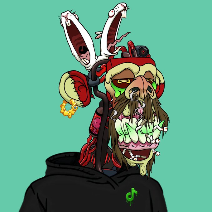 A vibrant digital cartoon illustration of a grotesque, zombie-like character with bulging eyes, a wide mouth of rotting teeth, and two small white rabbits emerging from tubes on its head, wearing a black hoodie with a green dripping logo.