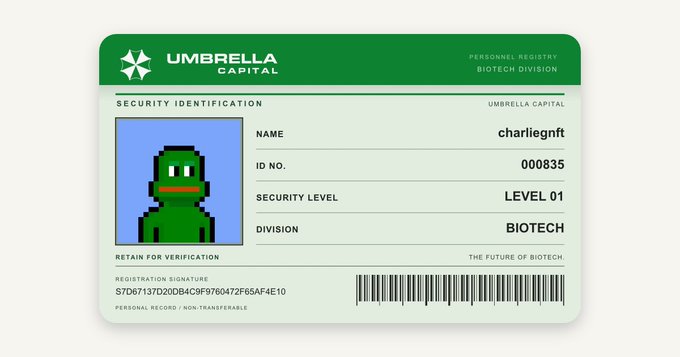 An 'Umbrella Capital' security identification card shows a green pixelated frog character named 'charliegnft' in the Biotech Division, Level 01.