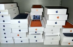 A stack of shoe boxes featuring the Apple logo, some bearing "Air" branding. The image appears unrelated to the post's claims about Bitcoin and RSI trend lines breaking to predict another 500% rise.