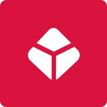 The image features the Blockchain.com logo, depicted as a white geometric cube icon on a red rounded background. It visually represents the cryptocurrency platform mentioned in the post announcing its partnership with the NYSE to offer tokenized U.S. stocks and ETFs.