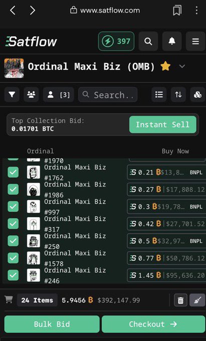 A mobile screenshot of satflow.com showing the 'Ordinal Maxi Biz (OMB)' collection page with an Instant Sell option at 0.01701 BTC top bid and a list of Ordinals for sale ranging from $13,813 to $95,636.