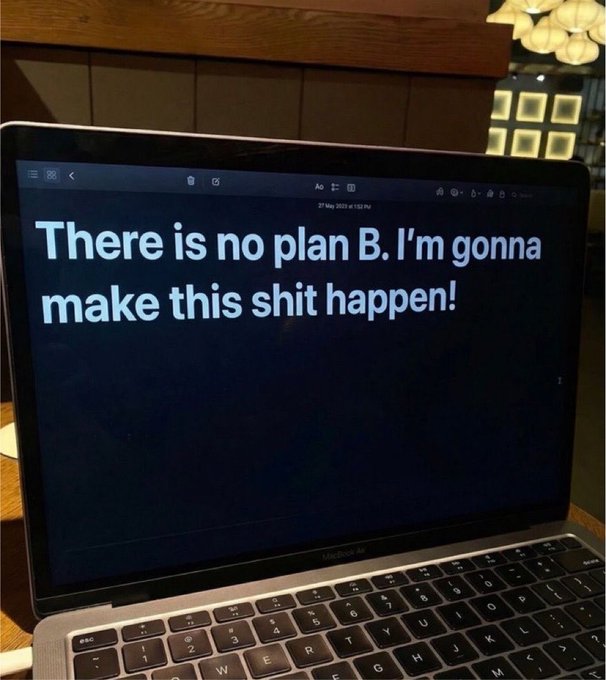 A photograph of a MacBook Air laptop screen displaying the motivational text 'There is no plan B. I'm gonna make this shit happen!'