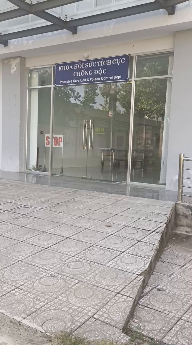 The image shows a glass door with a "stop" sign posted above it. The door leads into an office building, which appears to be a bank or financial institution. The post also mentions that users can transfer their assets using a wrapper/cosigner mechanism instead of transferring everything to a new wallet. This means that the user would wrap their current wallet with Quantum-resistant signatures and add them as part of the transfer process.
